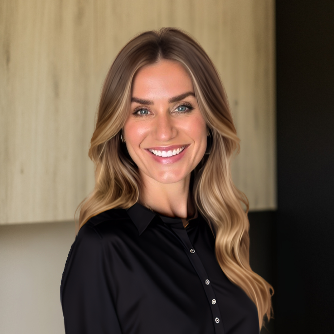 Smiling woman with long hair in a black shirt, representing MK Aesthetics Med Spa in Minnetonka.