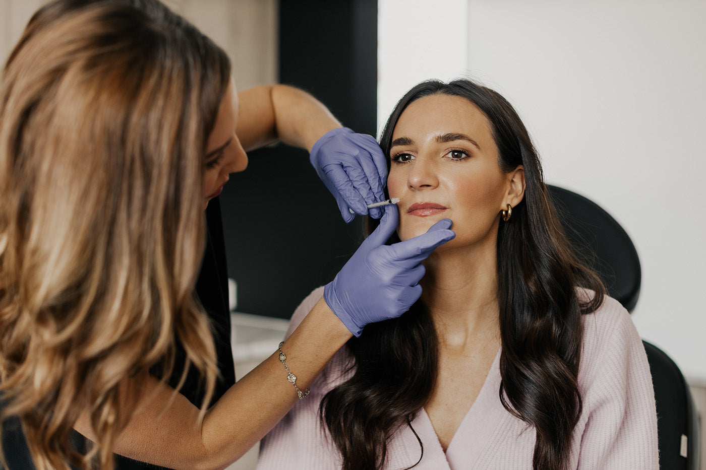 Client receiving treatment at MK Aesthetics Med Spa in Minnetonka, showcasing professional skincare services.