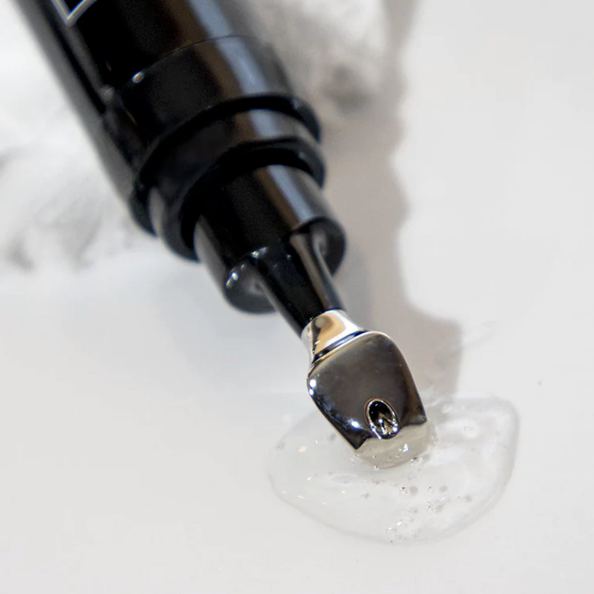 Revox™ Line Relaxer 1 fl oz serum nozzle dispensing product for anti-aging benefits at MK Aesthetics.