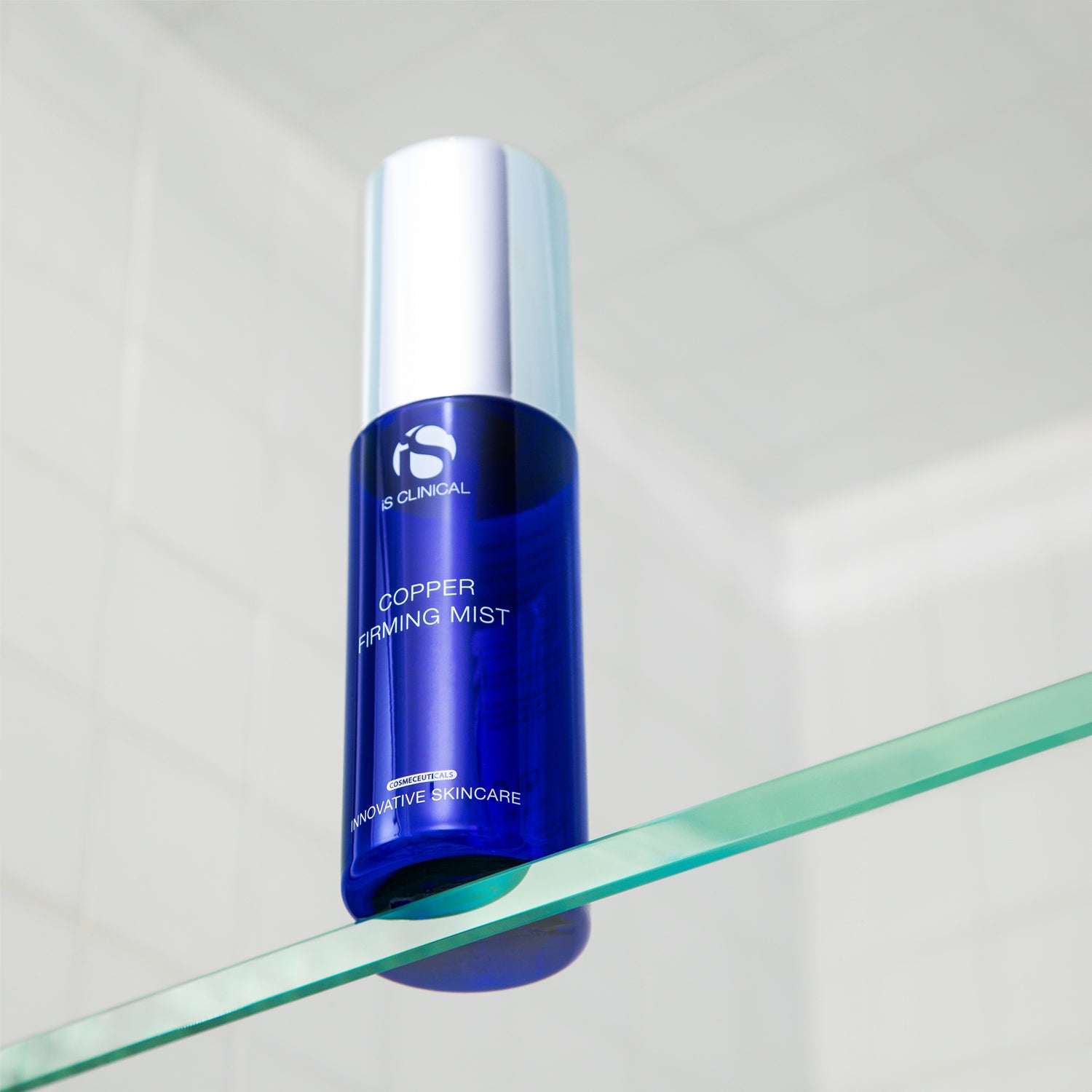 Copper Firming Mist bottle on a shelf, showcasing MK Aesthetics products for youthful skin.