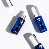 IS Clinical Copper Firming Mist bottles arranged on a white background, showcasing age-defying skincare benefits.