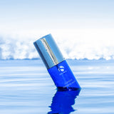 Copper Firming Mist bottle floating in water, showing MK Aesthetics and Aesthetics Spa branding.