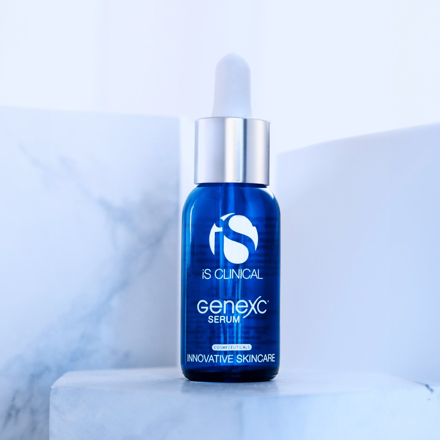 GeneXC Serum in blue bottle, offering advanced skin protection and rejuvenation for youthful appearance.