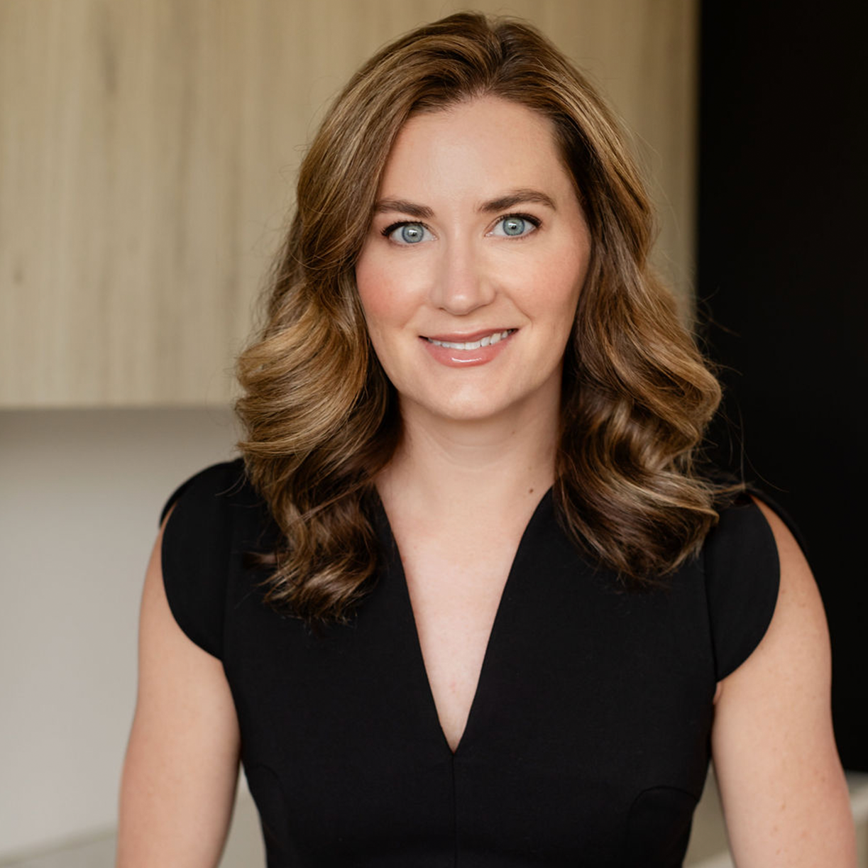 Professional woman at MK Aesthetics Med Spa in Minnetonka, showcasing beauty and wellness services.