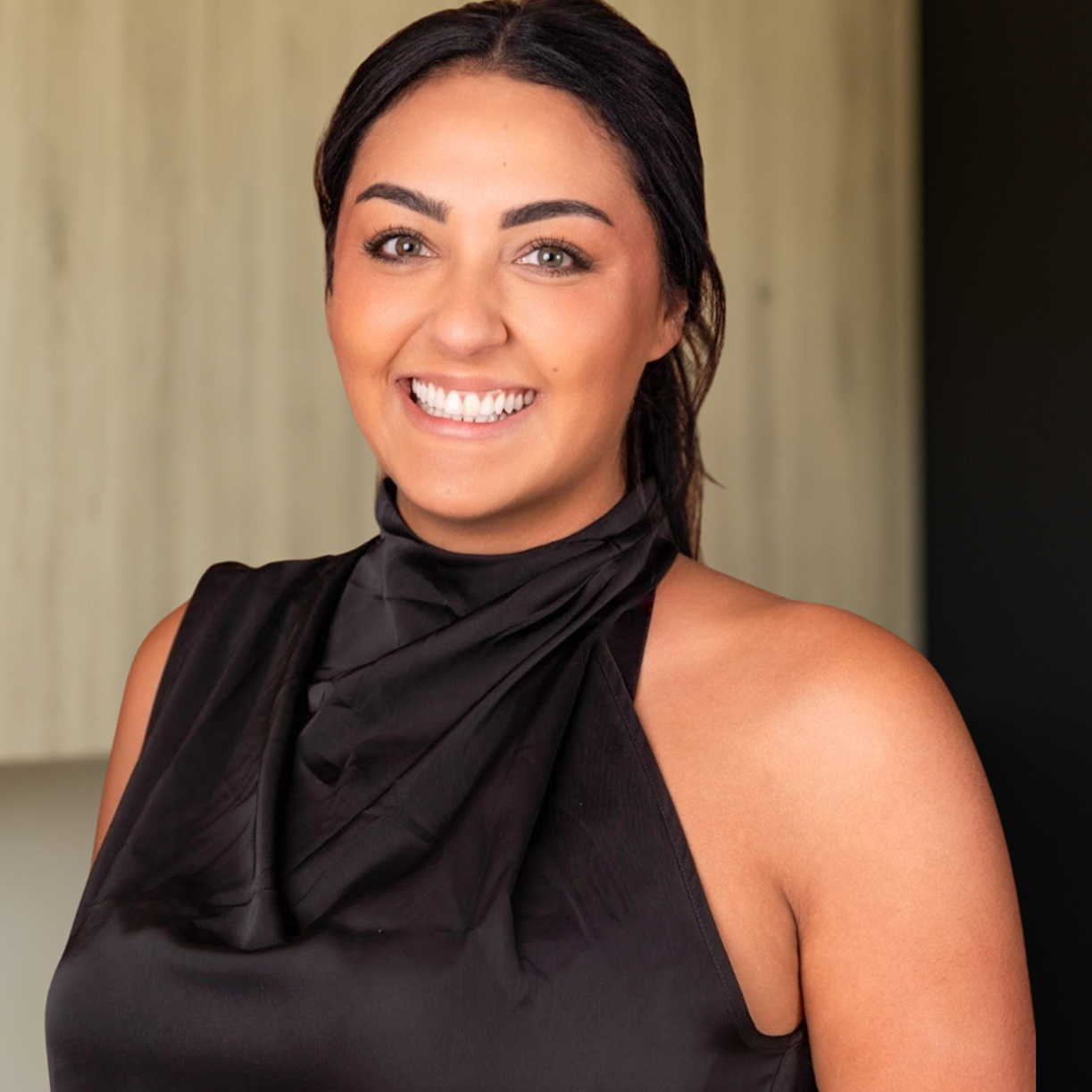 A smiling professional from MK Aesthetics, representing the Med Spa in Minnetonka, showcasing a welcoming environment.