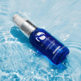 Hydra-Cool Serum by IS Clinical, a hydrating skincare product, floating in water. Perfect for all skin types.