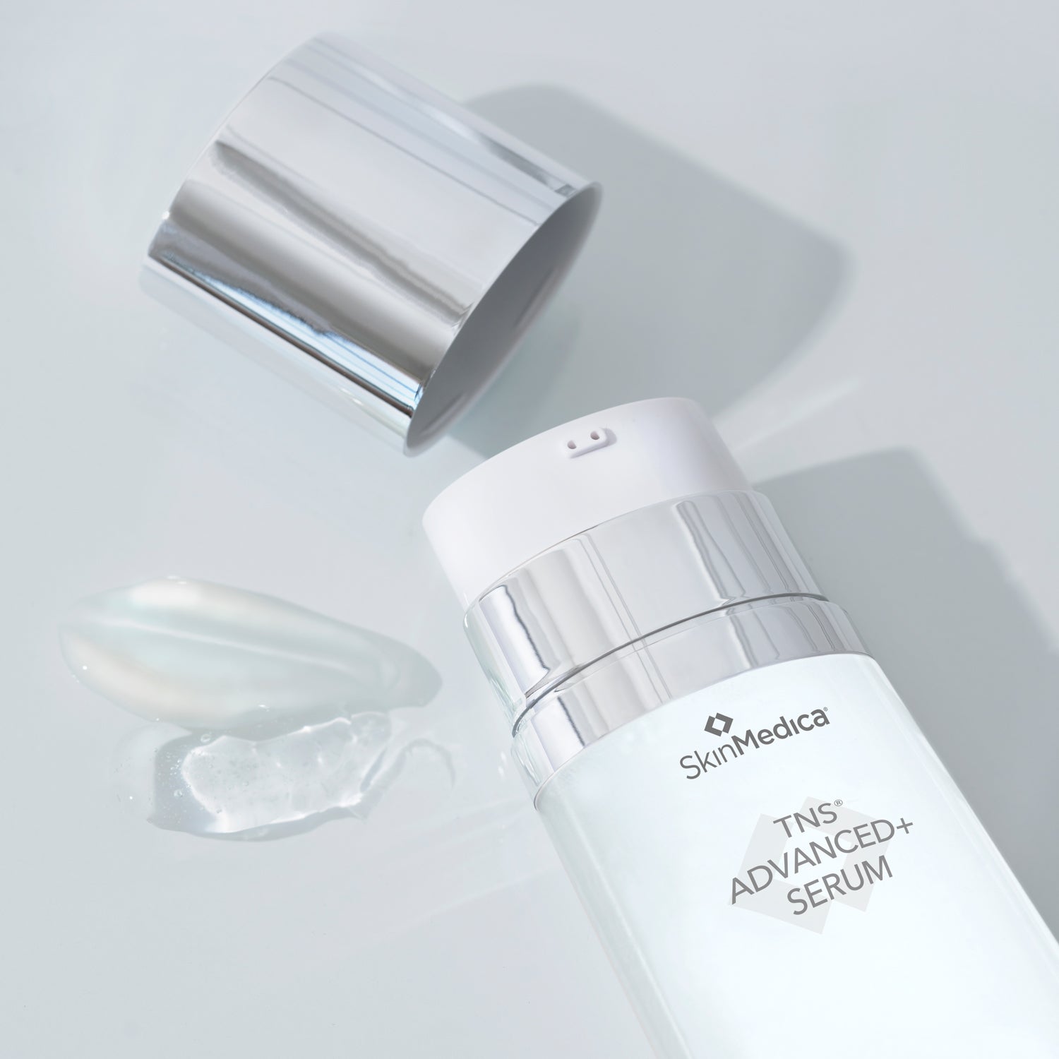 TNS® Advanced+ Serum in a sleek bottle with reflective cap, perfect for rejuvenating skin at MK Aesthetics Spa.