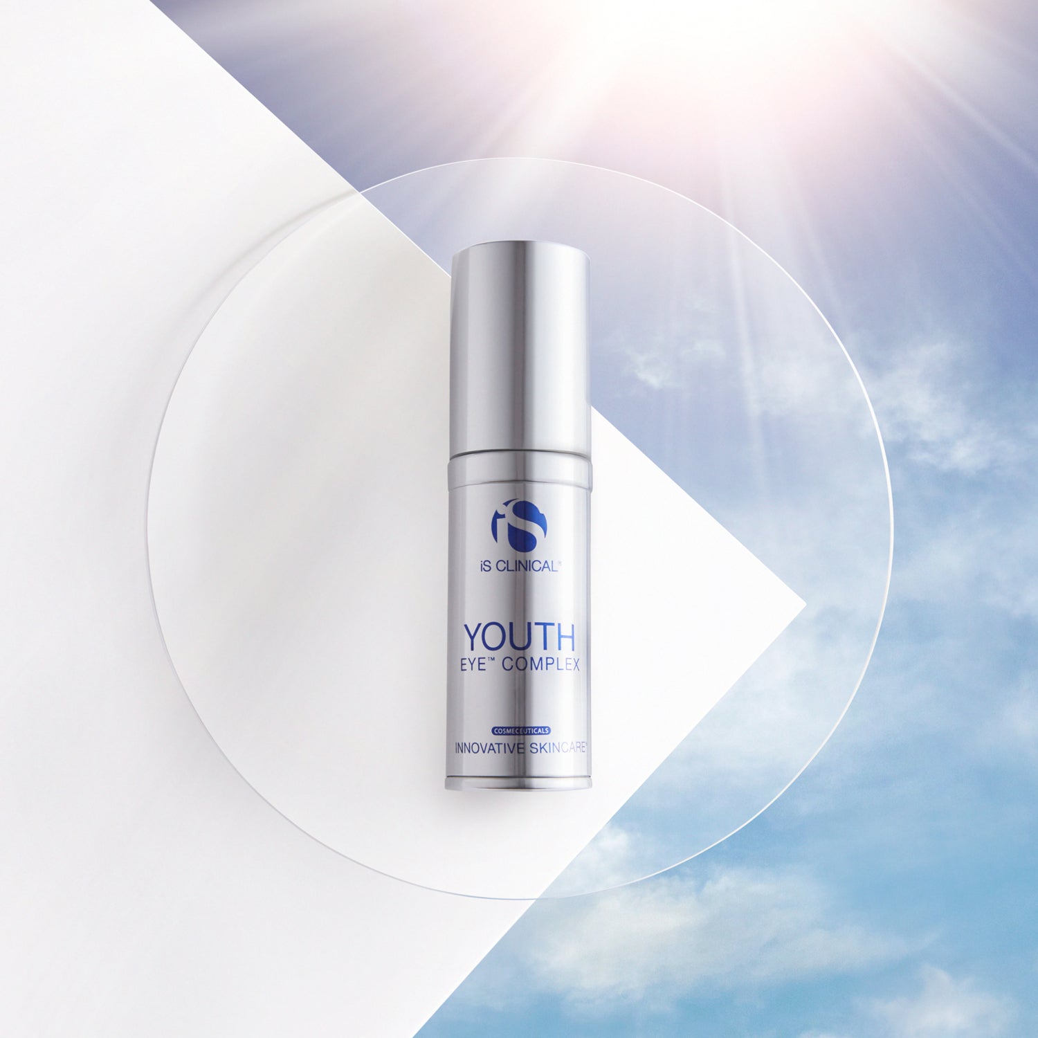 Youth Eye Complex by iS Clinical in a sleek bottle against a bright sky background, enhancing youthful skin.