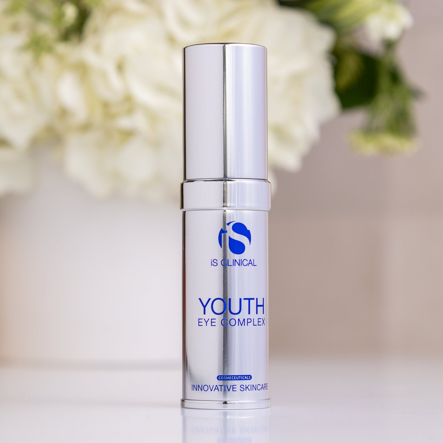 Youth Eye Complex by IS Clinical in a sleek silver bottle for innovative skincare.