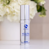 Youth Eye Complex by IS Clinical in a sleek silver bottle for innovative skincare.