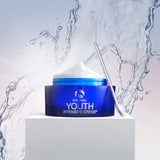 Youth Intensive Crème 1.7oz in a blue jar with a silver applicator against a water splash background.